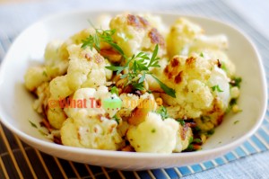 GARLIC-ROASTED CAULIFLOWER WITH PINE NUTS