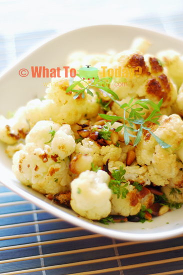 GARLIC-ROASTED CAULIFLOWER WITH PINE NUTS