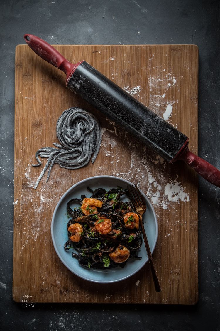 Homemade squid ink pasta with shrimp and garlicky tomato sauce