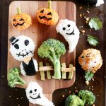 Onigiri for Halloween. Made with rice, Nori seaweed, Veggie straws, etc. Kids will have fun without extra sweets. They have enough sweets in their buckets ;)