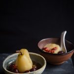 longan, red dates, goji berries poached pears in two bowls ready to be served