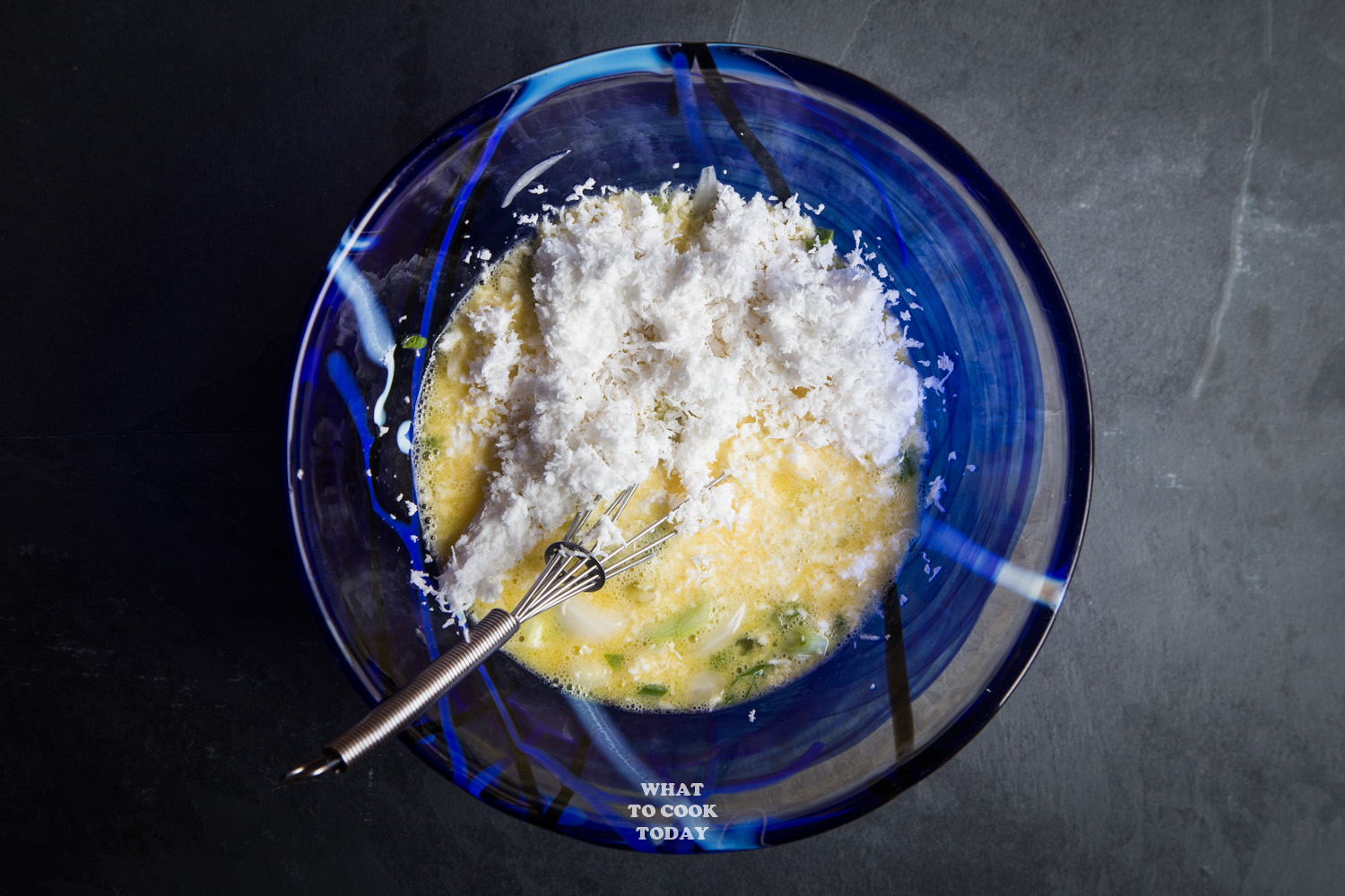 eggs and grated coconut in mixing bowl
